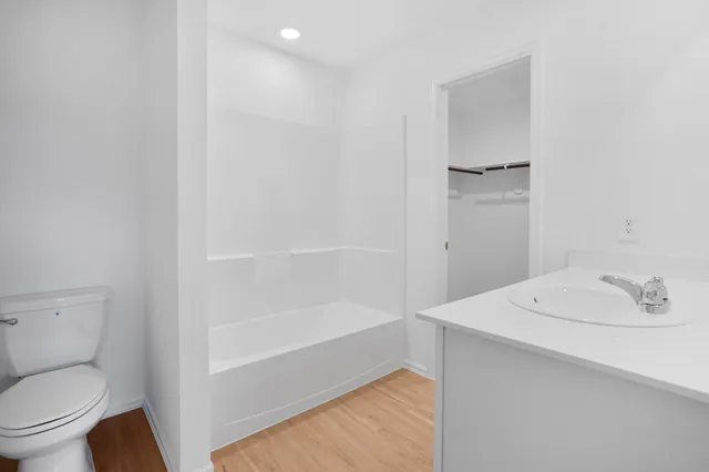 a bathroom with a sink toilet and vanity