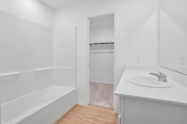 a bathroom with a sink and a bathtub