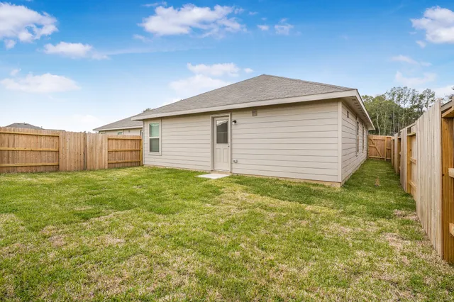 a backyard of a house with lots of green space