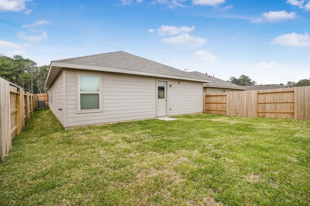 a backyard of a house with lots of green space