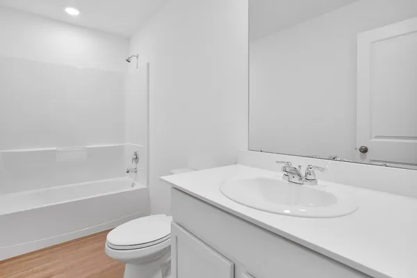 a bathroom with a sink toilet and a bathtub