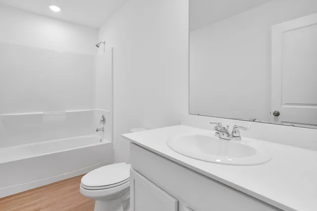 a bathroom with a sink toilet and a bathtub