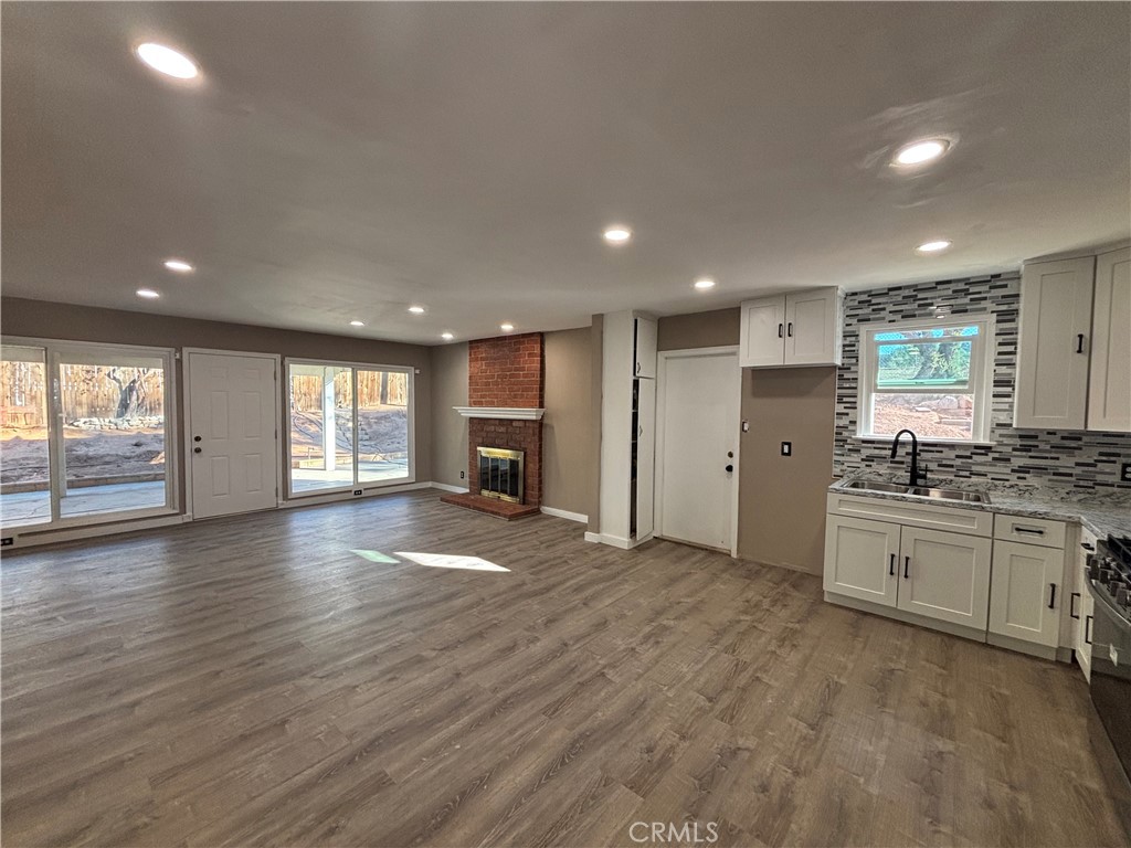 15360 Washington Street Riverside, CA 92506 - Photo 2 of 14 a view of a kitchen with a sink and a stove top oven