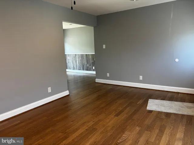 a view of a livingroom with wooden floor