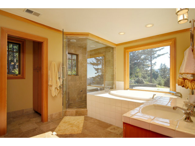 220 Ware Road Woodside, CA 94062 - Photo 14 of 19 a bathroom with a sink mirror and a bath tub