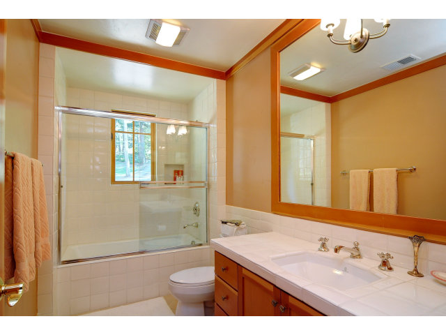 220 Ware Road Woodside, CA 94062 - Photo 16 of 19 a bathroom with a sink and a mirror