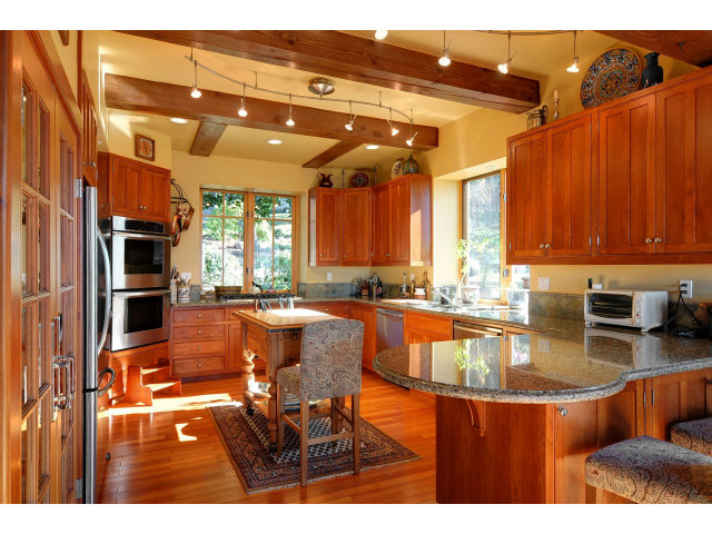 220 Ware Road Woodside, CA 94062 - Photo 8 of 19 a kitchen with stainless steel appliances granite countertop a sink and cabinets