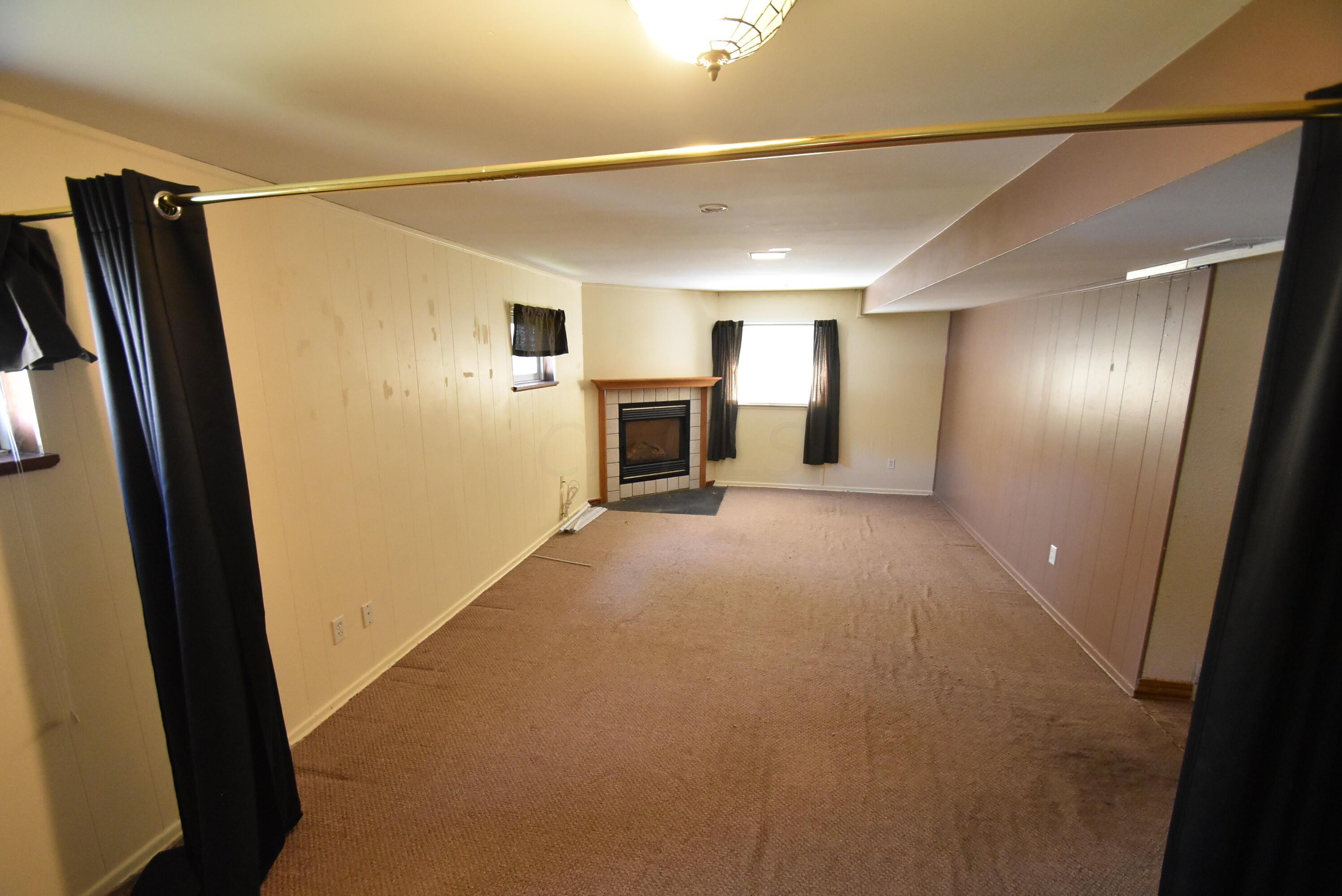 6658 Red Fox Road Reynoldsburg, OH 43068 - Photo 38 of 46 Lower Level Family/Rec Room w/fireplace Gas Log