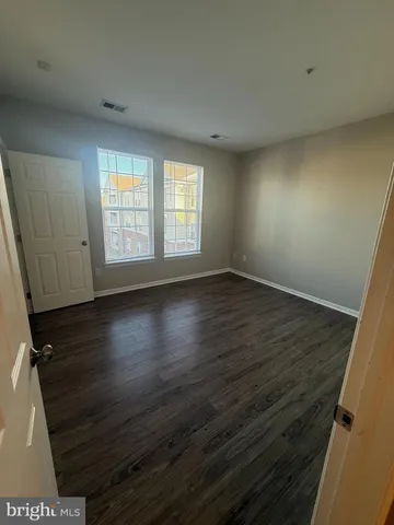 a bathroom with a toilet sink and shower