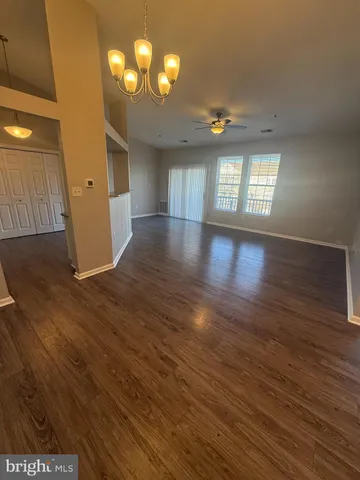 a view of a livingroom with wooden floor