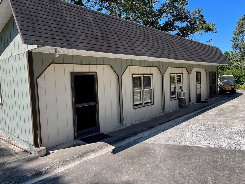 7128 Dawsonville Highway Dawsonville, GA 30534 - Photo 1 of 7 a front view of a house with a porch