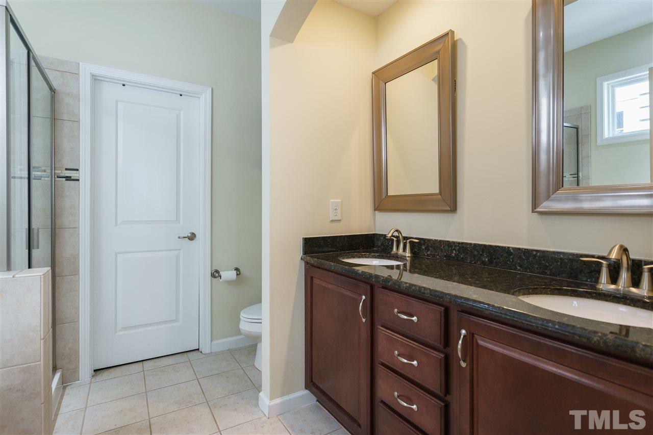 5622 Wade Park Boulevard Raleigh, NC 27607 - Photo 13 of 25 SPACIOUS MASTER BATH INCLUDES DOUBLE SINKS, GARDEN TUB, SHOWER, AND WIC. CERAMIC TILE AND GRANITE COUNTERS!