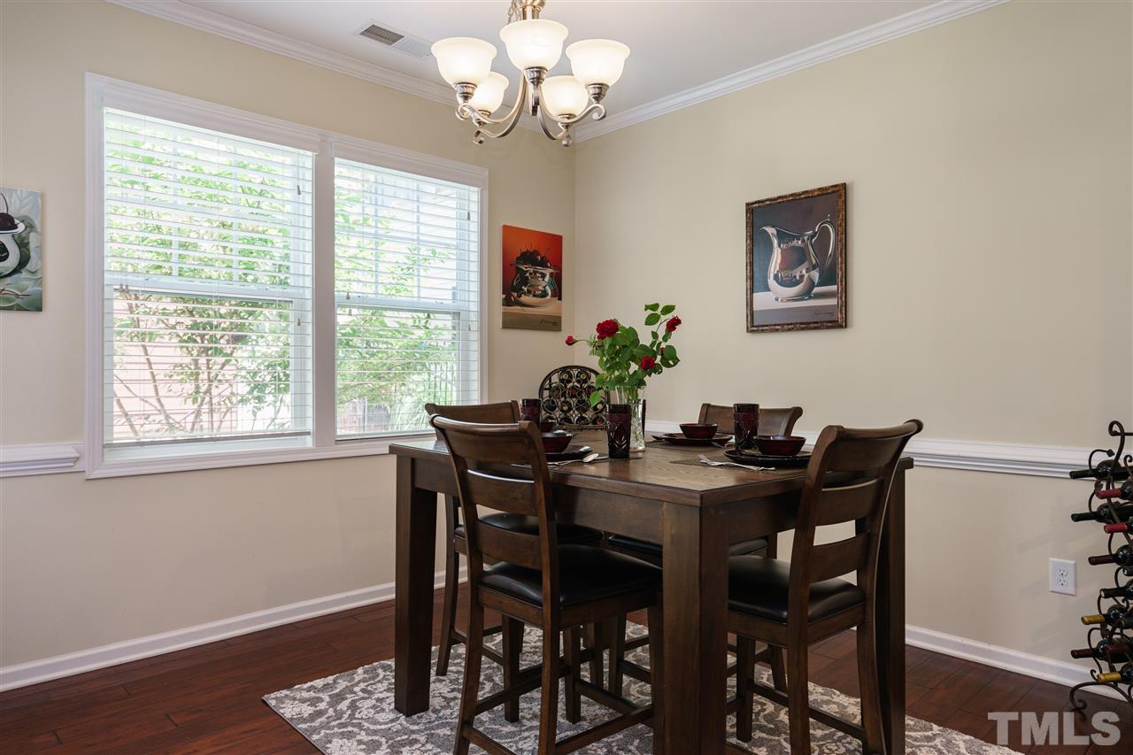 5622 Wade Park Boulevard Raleigh, NC 27607 - Photo 7 of 25 DINING ROOM WITH CHANDELIER OPENS EASILY TO LANDSCAPED BACKYARD AND KITCHEN AREA!