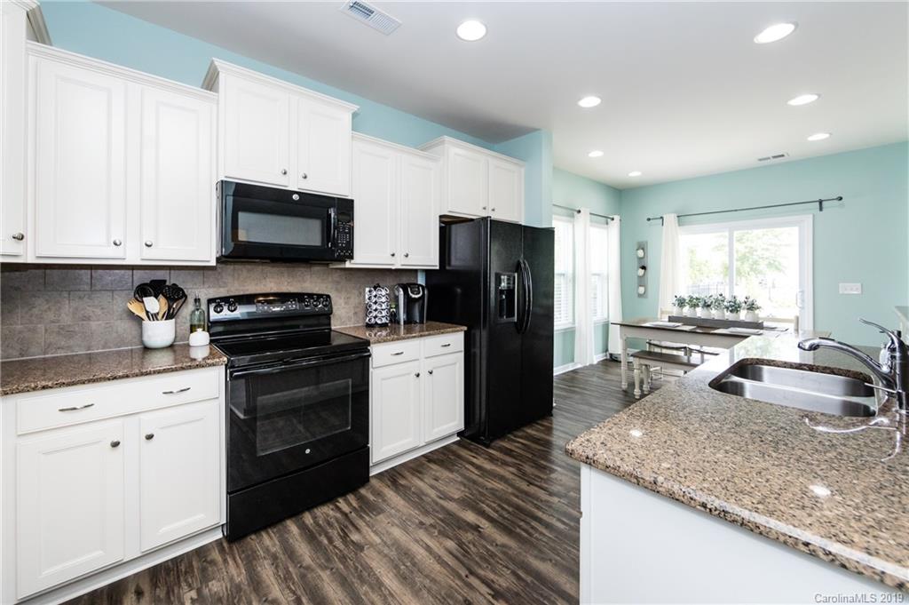 79481 Ridgehaven Road Lancaster, SC 29720 - Photo 16 of 41 a kitchen with a sink stove and refrigerator