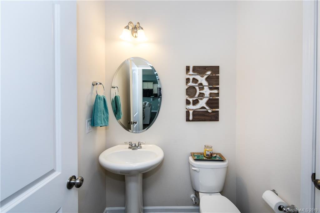 79481 Ridgehaven Road Lancaster, SC 29720 - Photo 19 of 41 a bathroom with a toilet sink and mirror