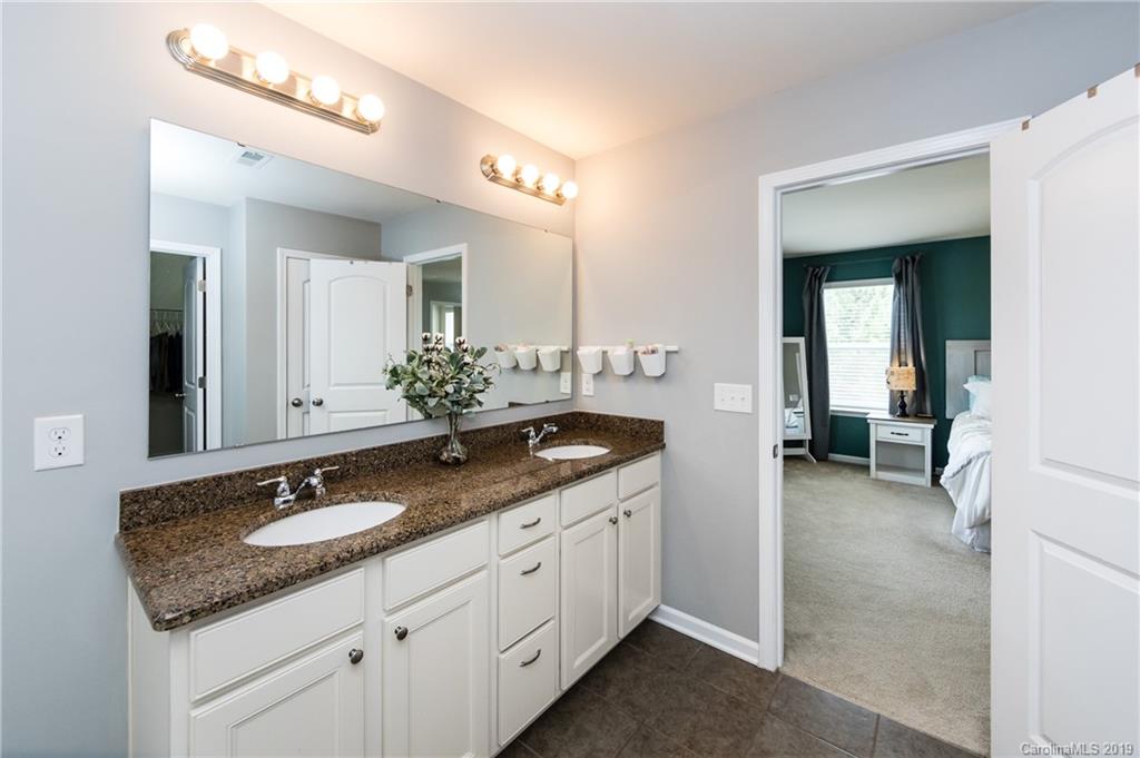 79481 Ridgehaven Road Lancaster, SC 29720 - Photo 24 of 41 a bathroom with a granite countertop sink and a mirror