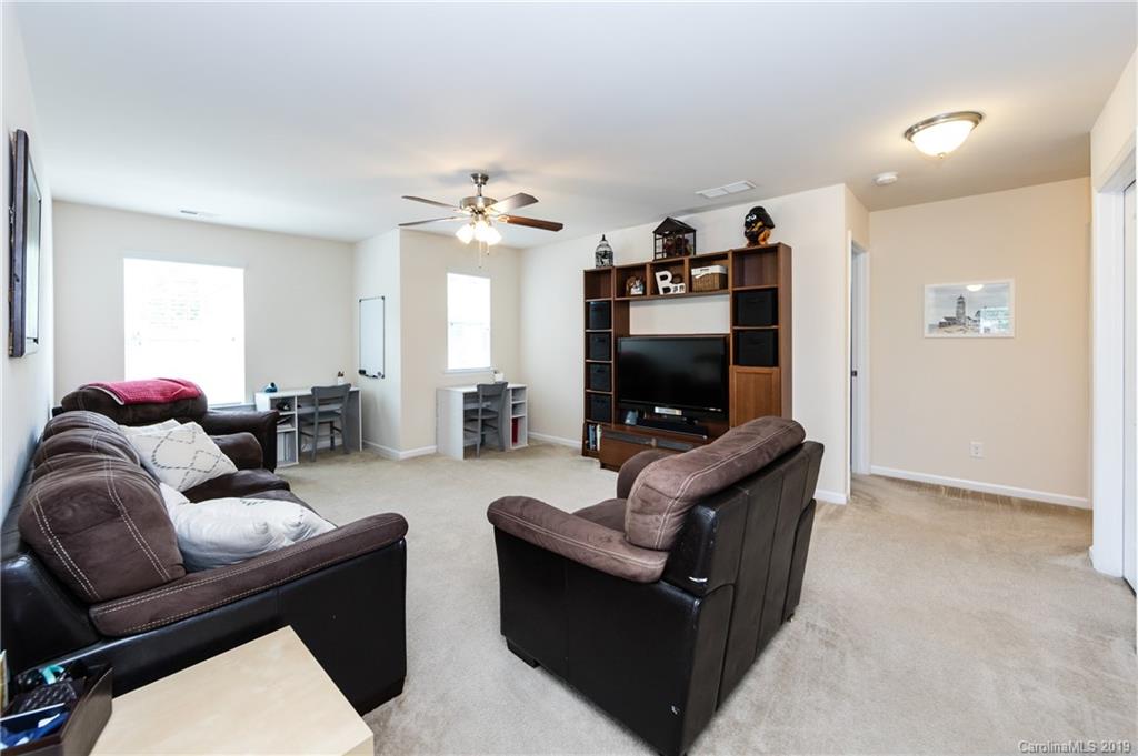 79481 Ridgehaven Road Lancaster, SC 29720 - Photo 34 of 41 a living room with furniture and a flat screen tv