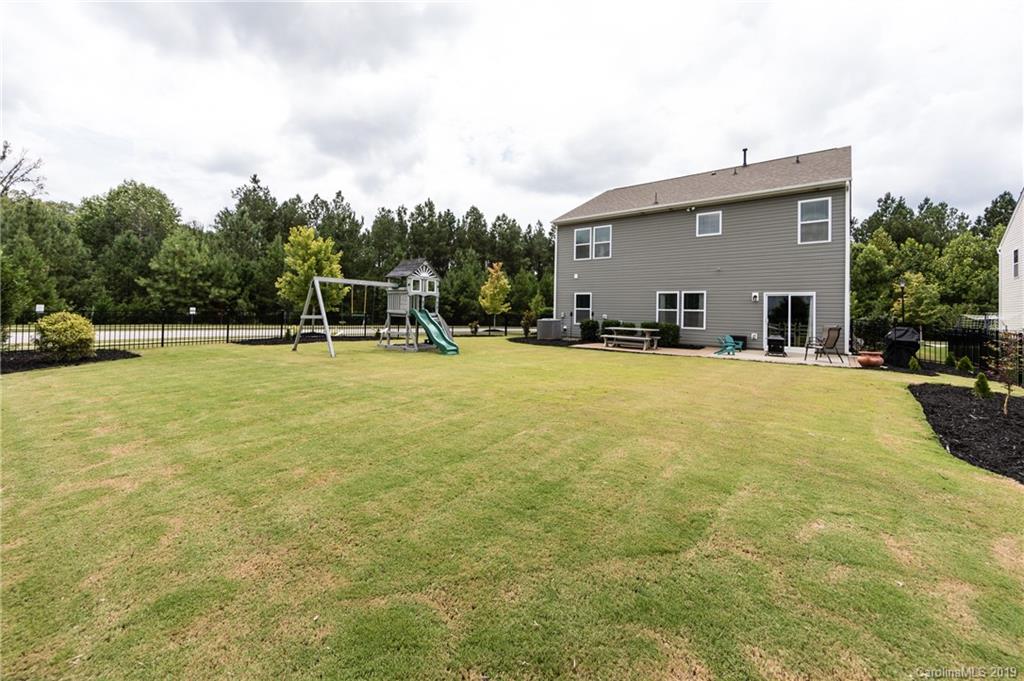 79481 Ridgehaven Road Lancaster, SC 29720 - Photo 35 of 41 a view of a swimming pool with outdoor seating and a yard