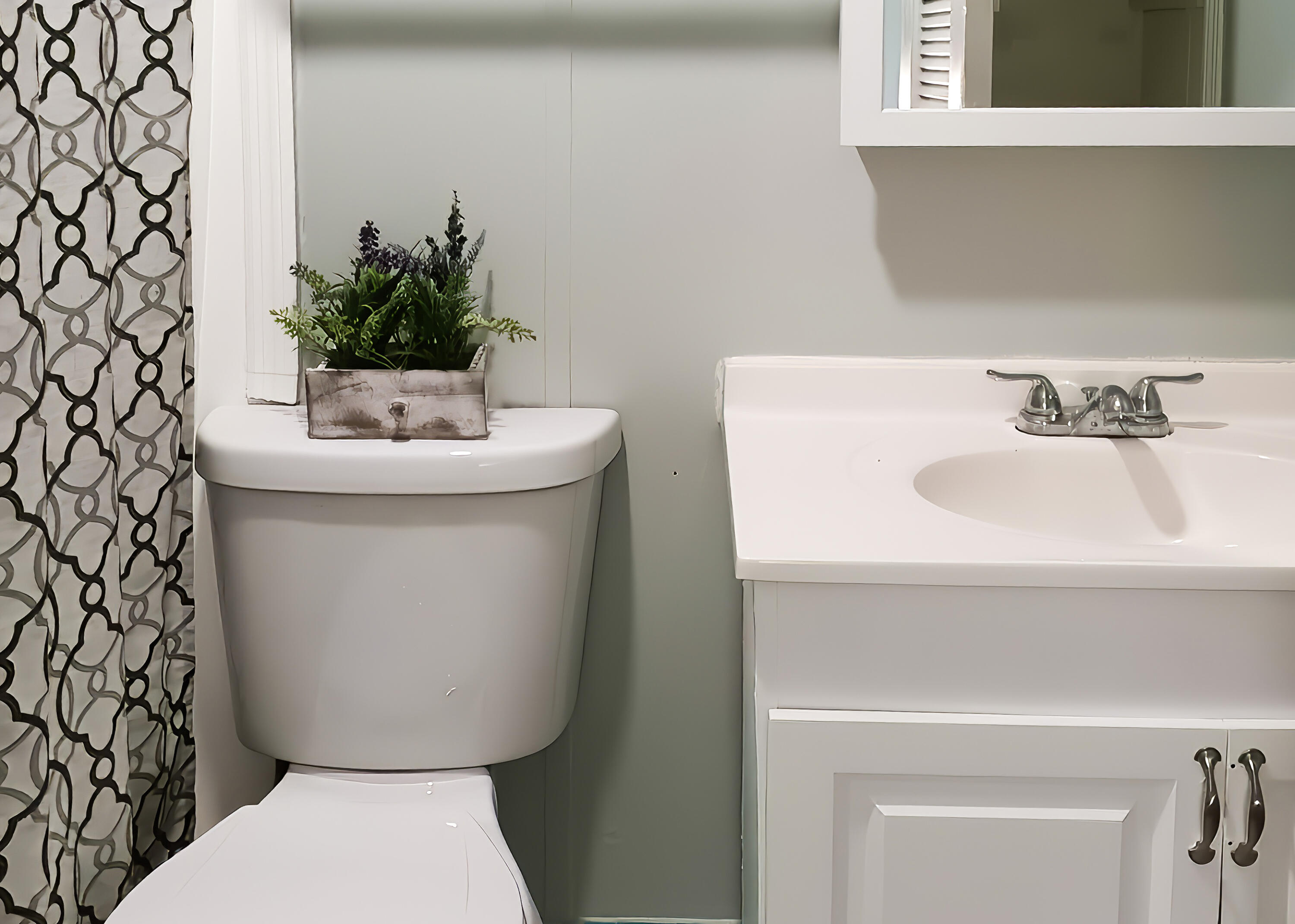 G34 Miriam Street Key West, FL 33040 - Photo 16 of 17 a bathroom with a toilet sink and mirror