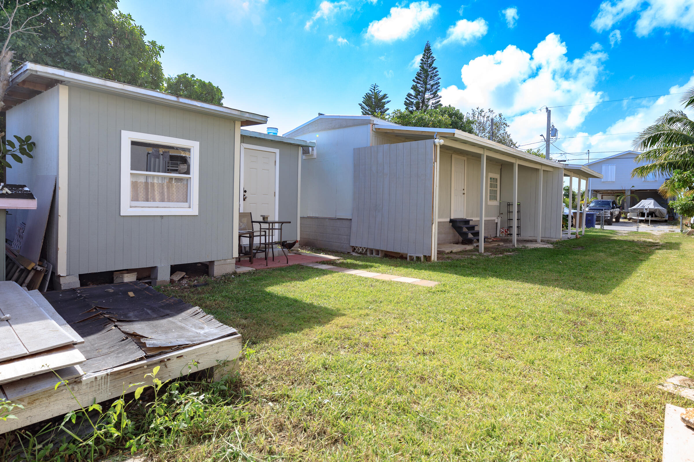 G34 Miriam Street Key West, FL 33040 - Photo 17 of 17 a backyard of a house with table and chairs