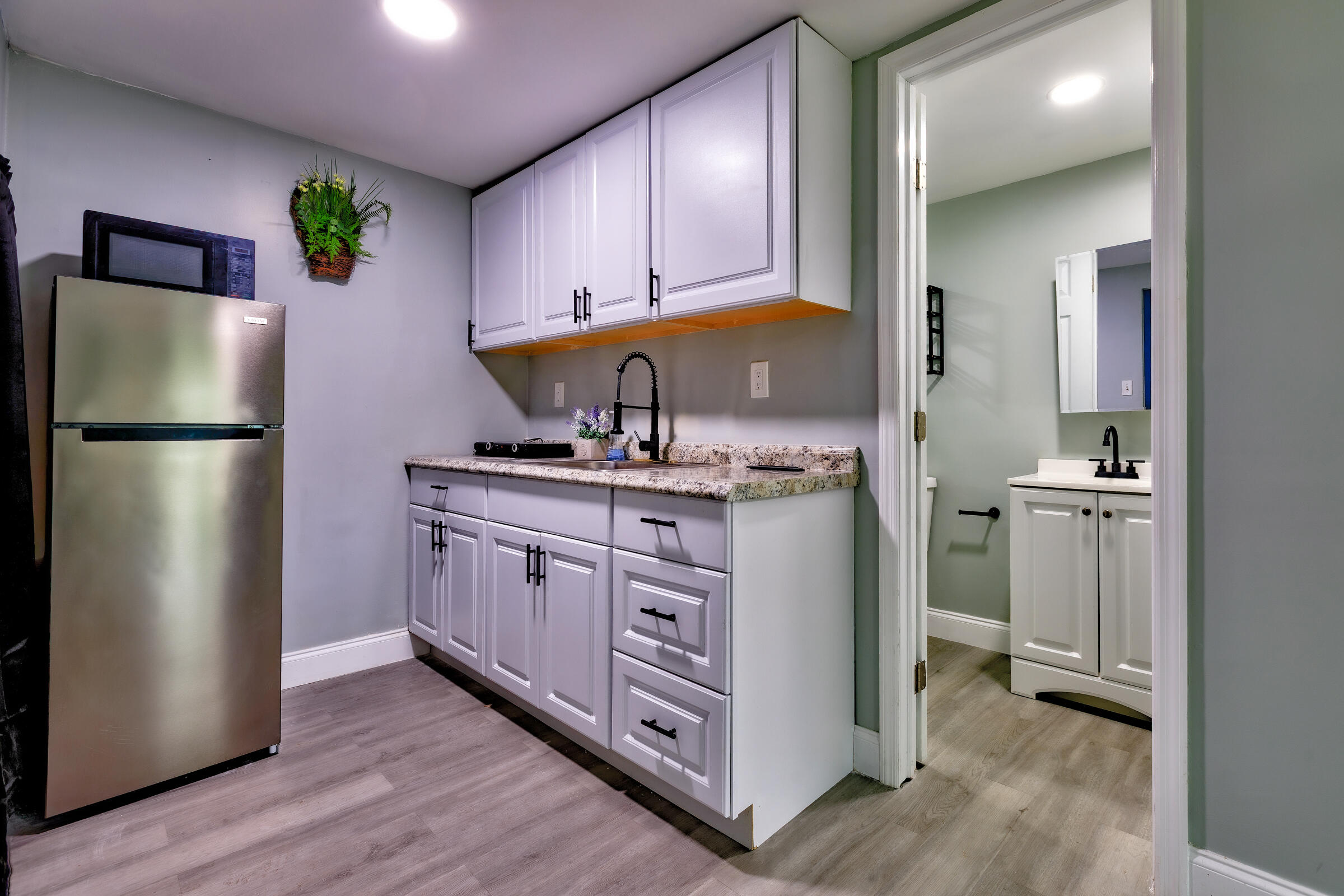 G34 Miriam Street Key West, FL 33040 - Photo 3 of 17 a kitchen with a refrigerator a sink and cabinets