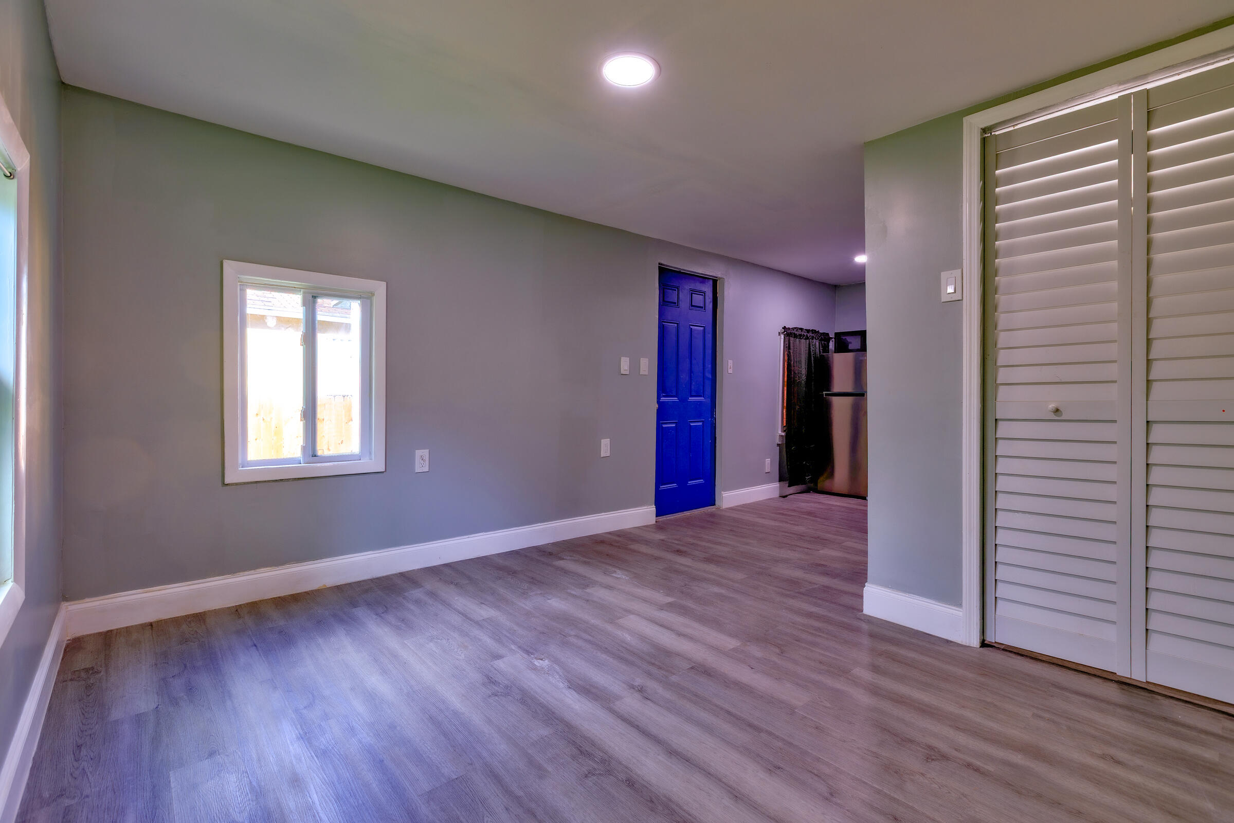 G34 Miriam Street Key West, FL 33040 - Photo 5 of 17 a view of an empty room with wooden floor and a window