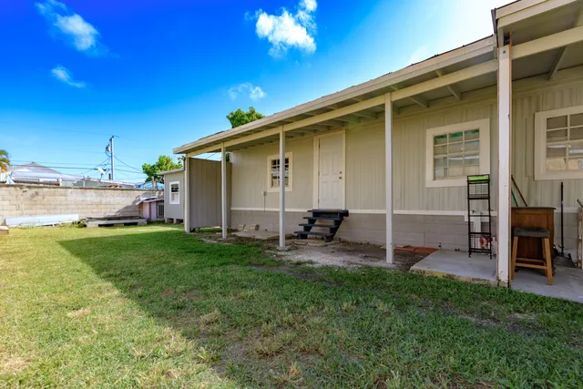 a view of backyard with a patio