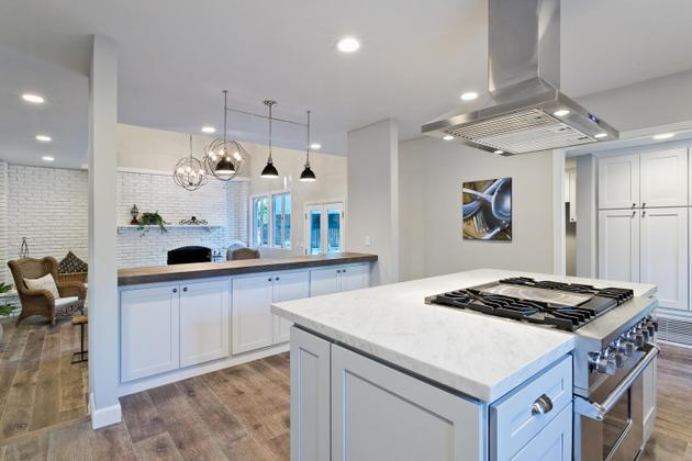 604 Gridley Road Ojai, CA 93023 - Photo 23 of 50 a kitchen with a sink a stove a dining table and chairs