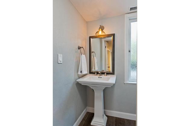 604 Gridley Road Ojai, CA 93023 - Photo 36 of 50 a bathroom with a sink a mirror and a window