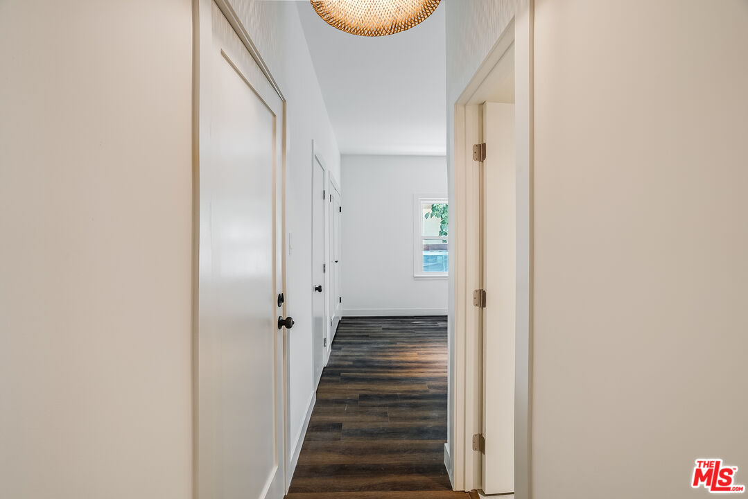 151 North Swall Drive, Unit 4 Beverly Hills, CA 90211 - Photo 2 of 17 a view of a hallway with wooden floor and staircase