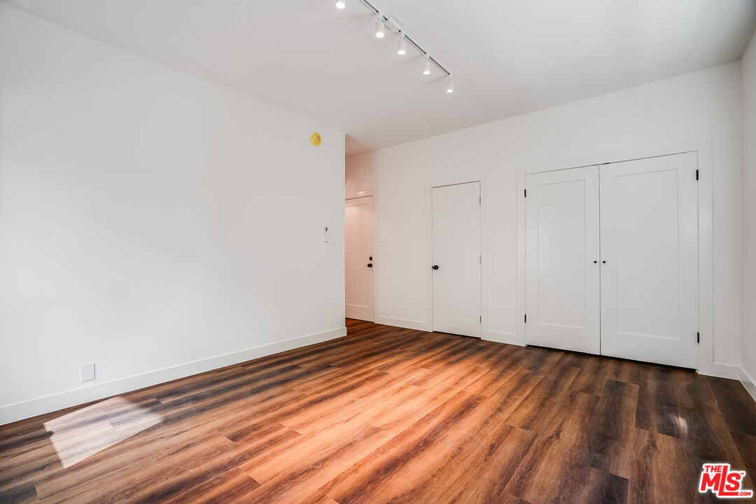 151 North Swall Drive, Unit 4 Beverly Hills, CA 90211 - Photo 6 of 17 a view of room with wooden floor