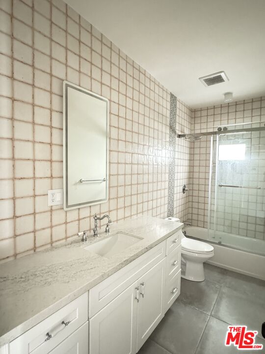 151 North Swall Drive, Unit 4 Beverly Hills, CA 90211 - Photo 10 of 17 a bathroom with a double vanity sink toilet and shower