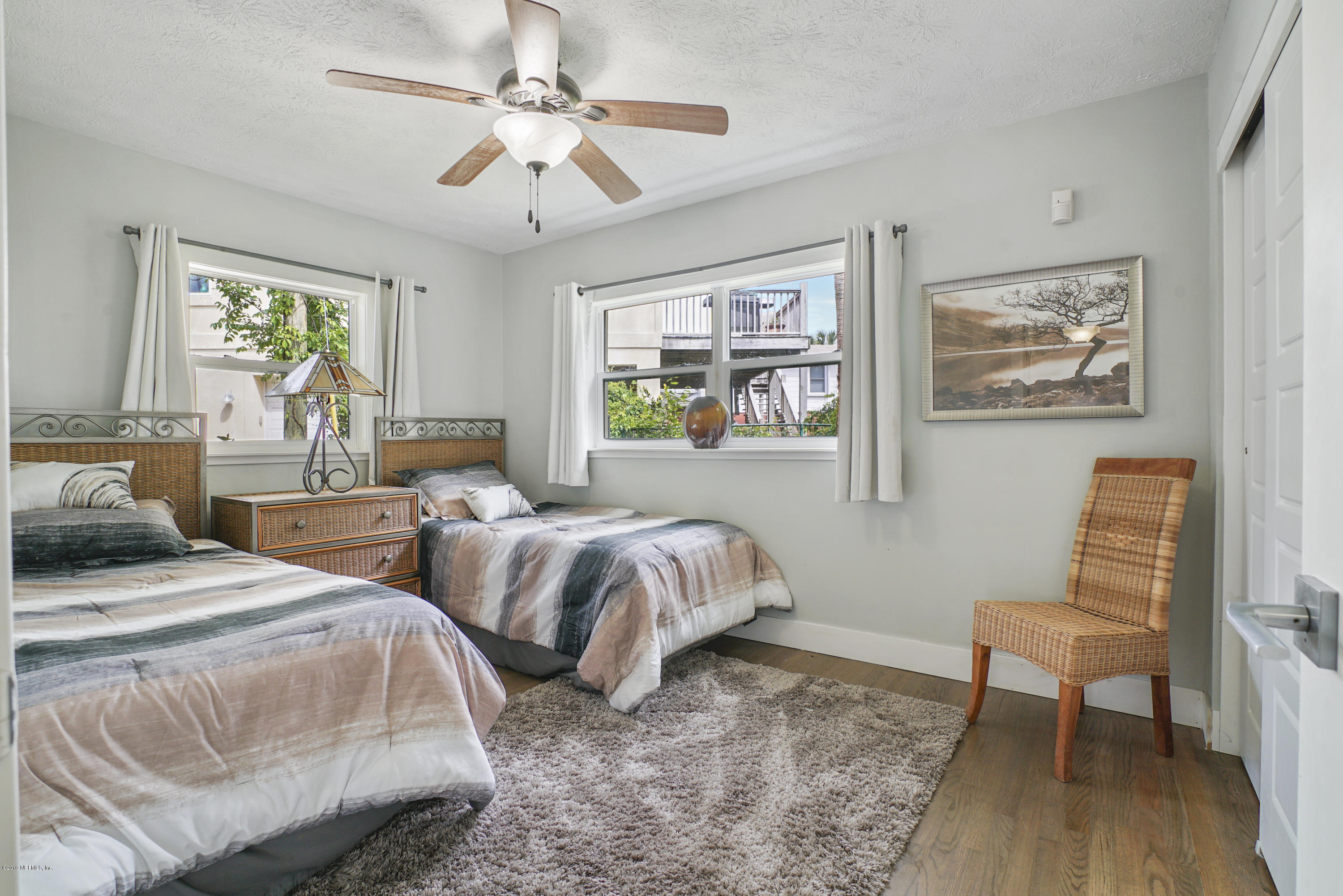 32 Dolphin Drive St. Augustine, FL 32080 - Photo 17 of 43 a spacious bedroom with two beds and a window