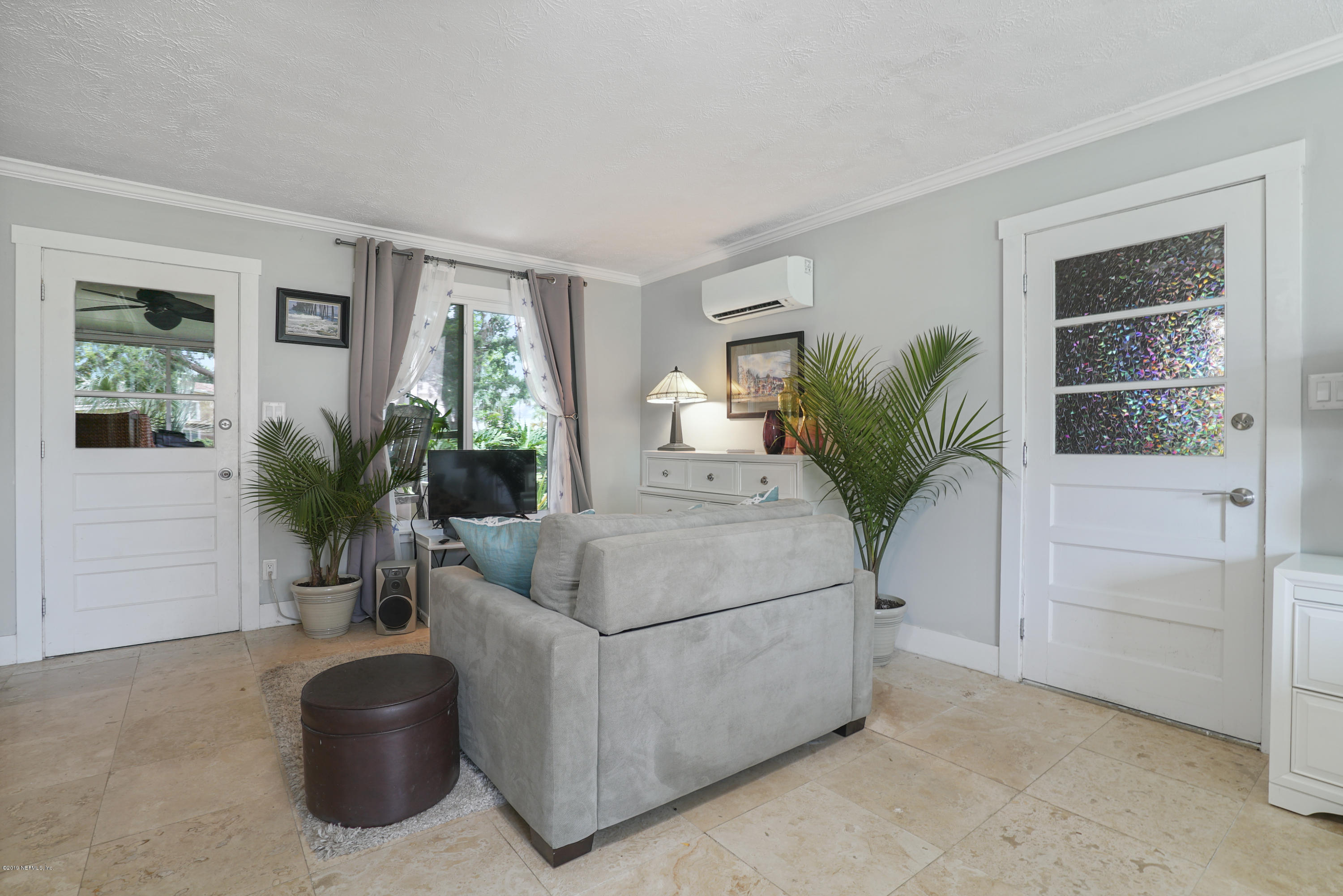 32 Dolphin Drive St. Augustine, FL 32080 - Photo 19 of 43 a living room with furniture potted plant and windows