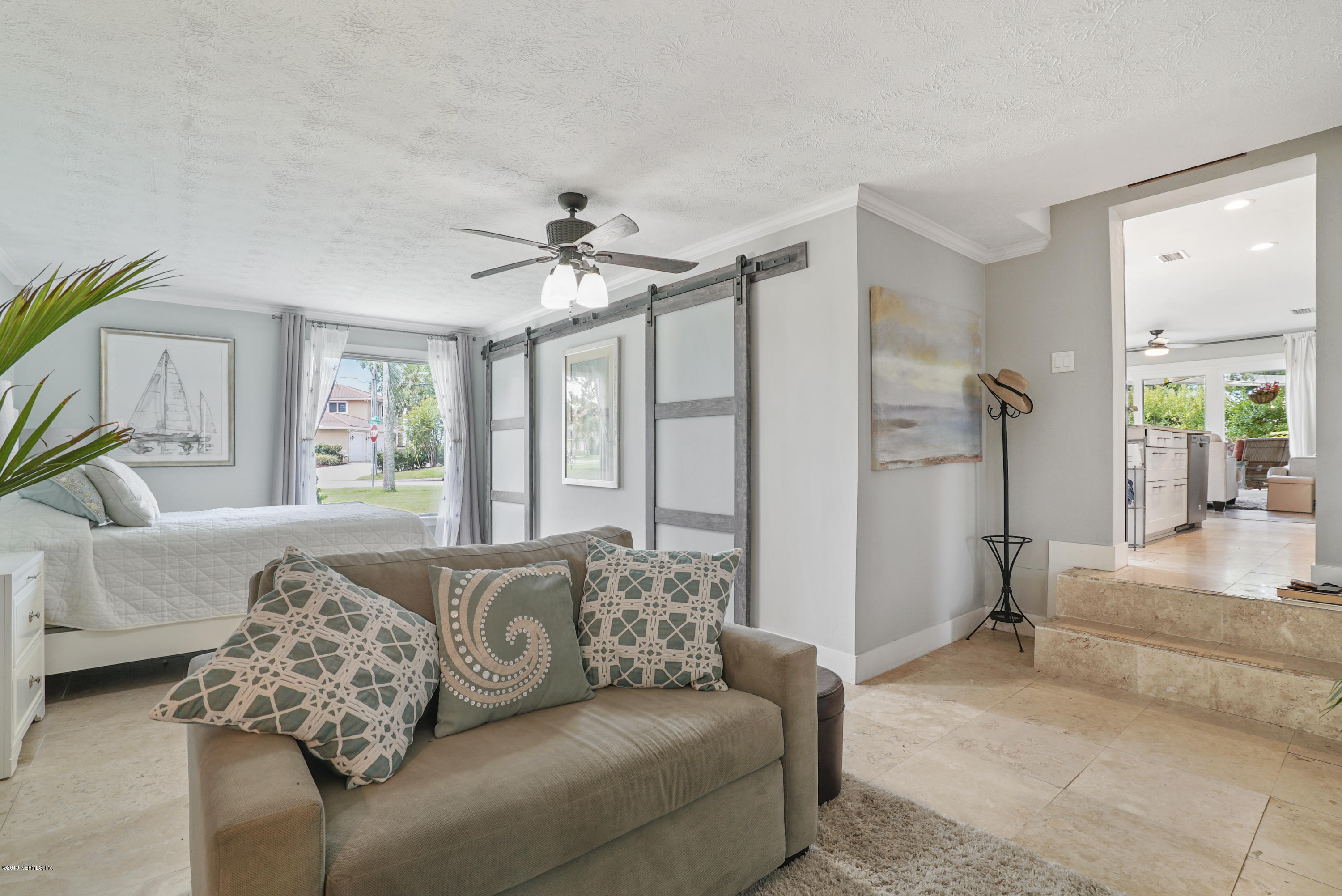 32 Dolphin Drive St. Augustine, FL 32080 - Photo 21 of 43 a living room with furniture and a large window