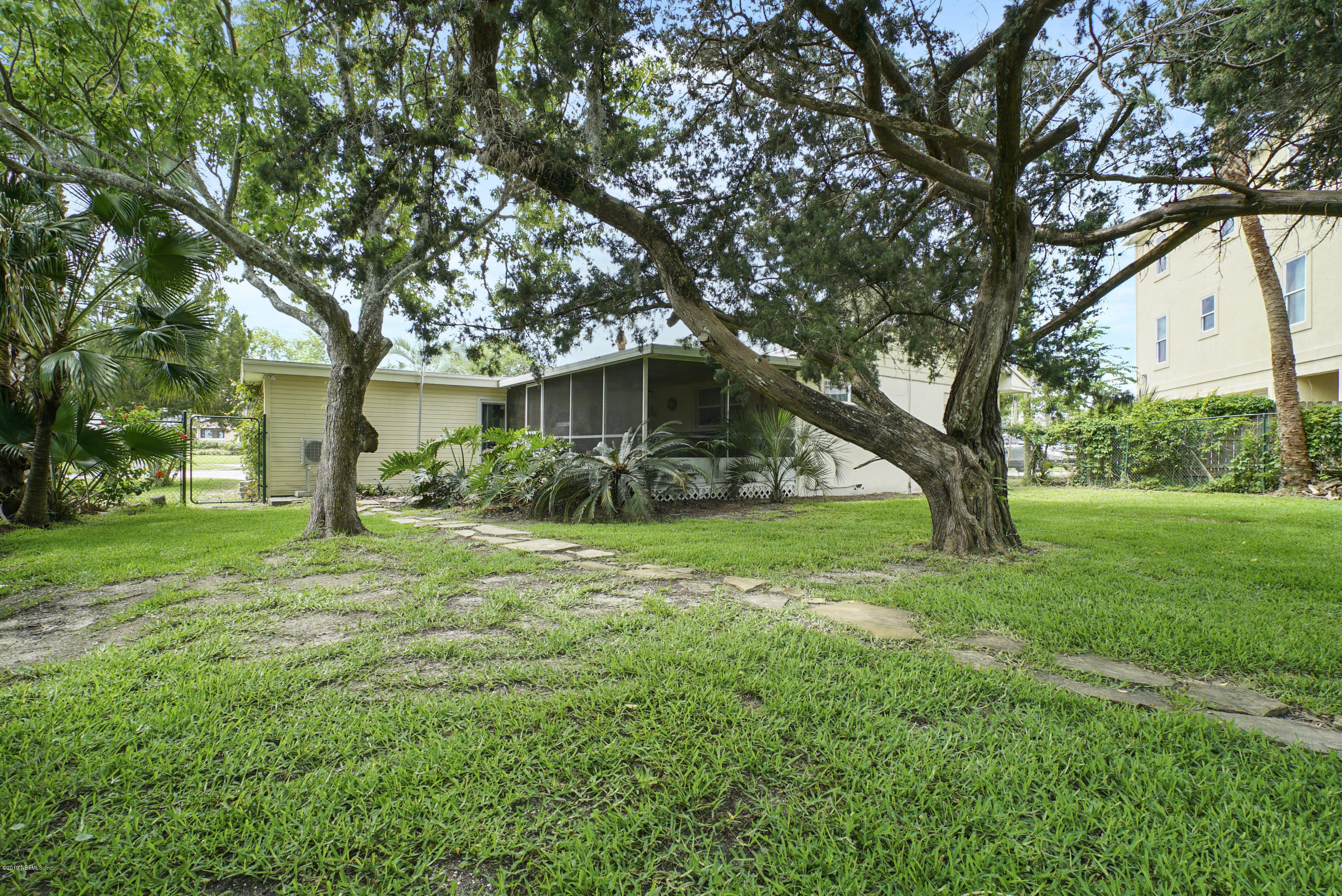 32 Dolphin Drive St. Augustine, FL 32080 - Photo 26 of 43 a front view of a house with garden