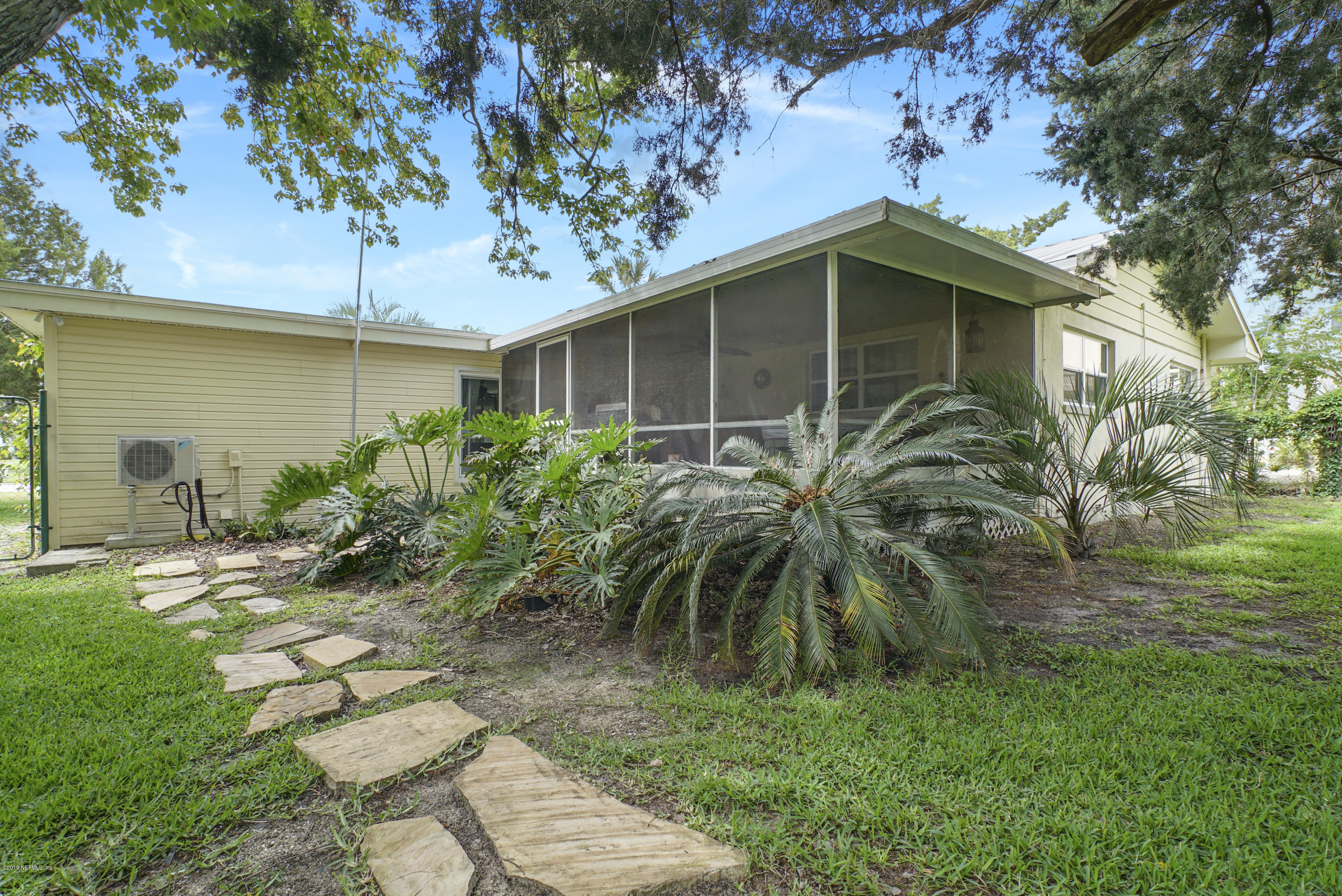 32 Dolphin Drive St. Augustine, FL 32080 - Photo 27 of 43 a front view of a house with garden
