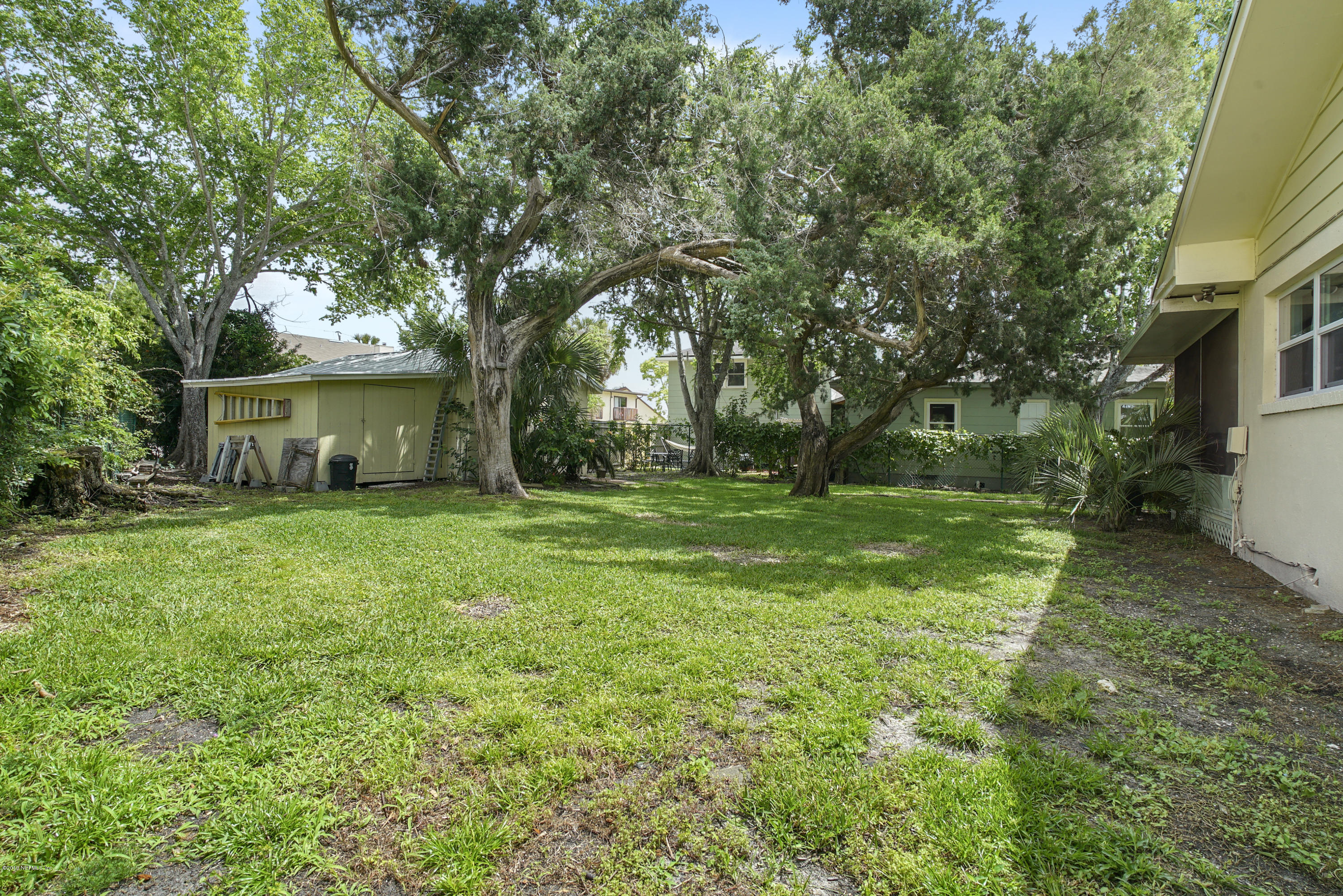 32 Dolphin Drive St. Augustine, FL 32080 - Photo 28 of 43 a view of a house with backyard and garden