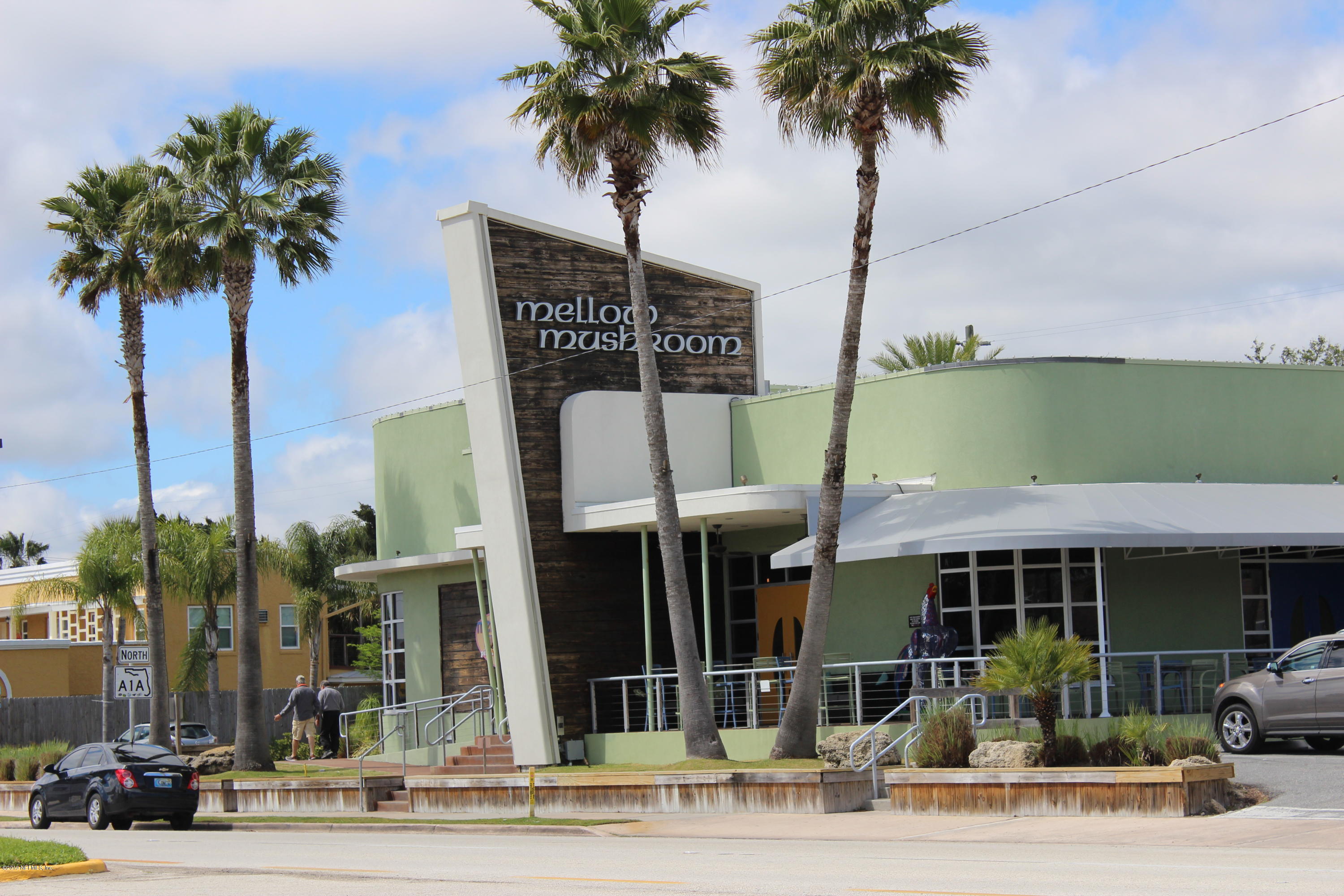 32 Dolphin Drive St. Augustine, FL 32080 - Photo 41 of 43 a front view of a building with palm trees