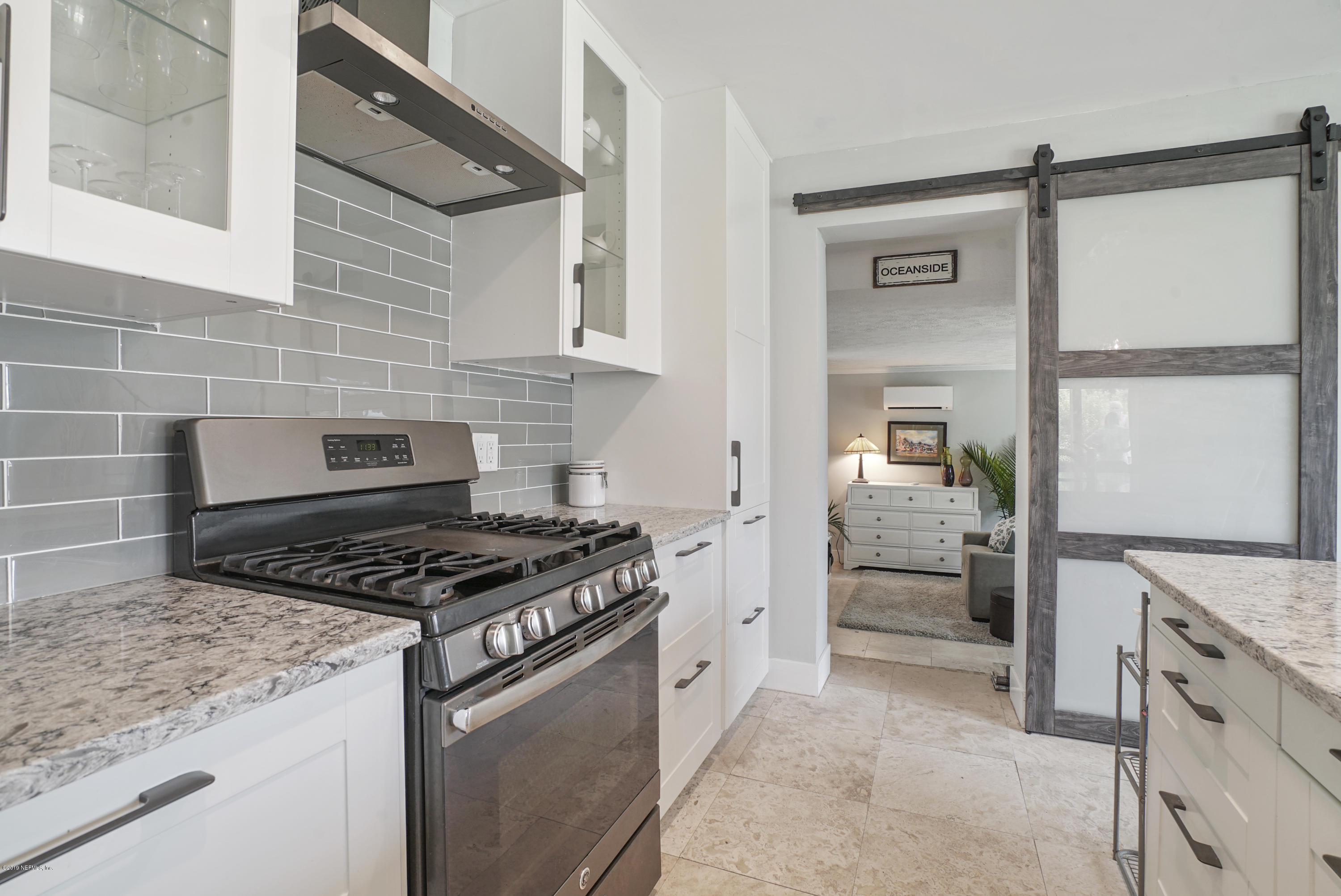 32 Dolphin Drive St. Augustine, FL 32080 - Photo 7 of 43 a kitchen with stainless steel appliances granite countertop a stove and a refrigerator