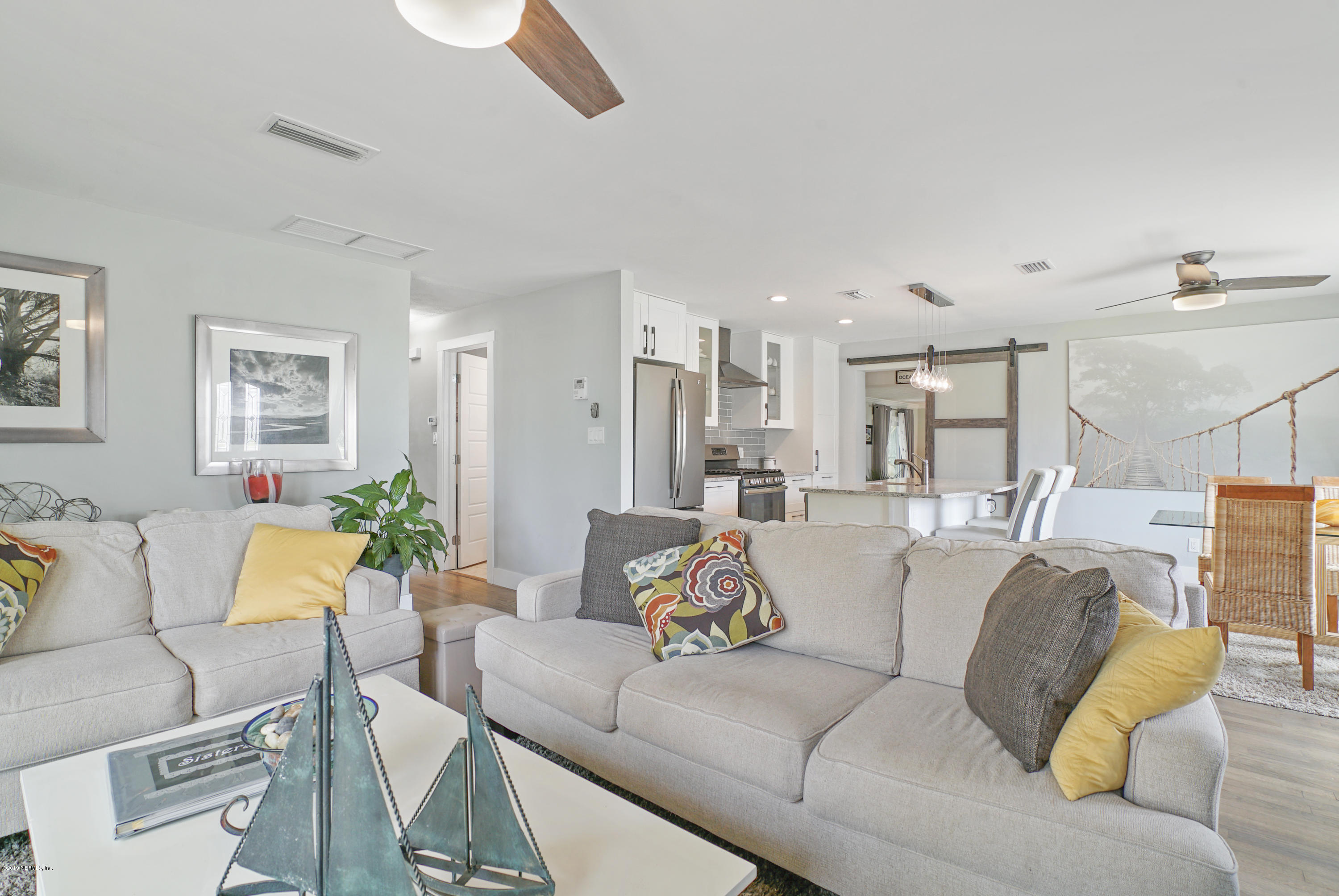 32 Dolphin Drive St. Augustine, FL 32080 - Photo 9 of 43 a living room with furniture and a large window