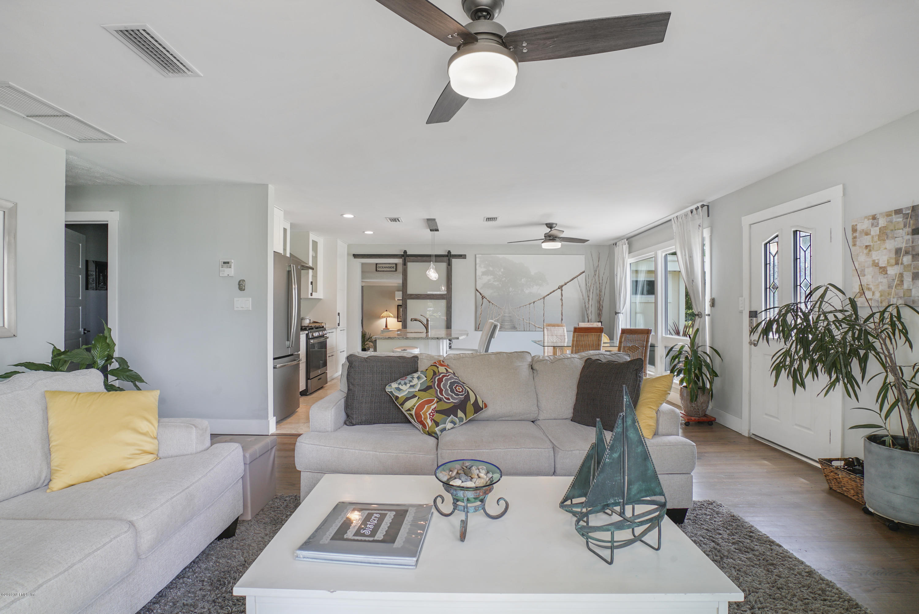 32 Dolphin Drive St. Augustine, FL 32080 - Photo 10 of 43 a living room with furniture and wooden floor