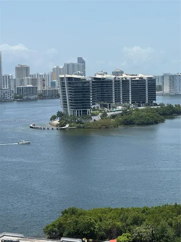 a view of building with outdoor space and lake view