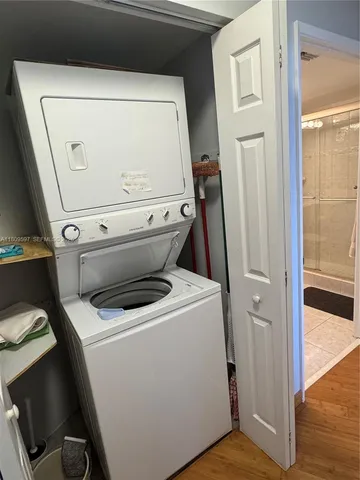 a bedroom with a bed and a cabinet