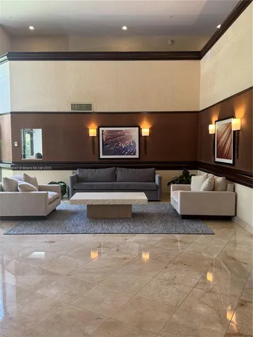 a living room with hardwood floor and a flat screen tv