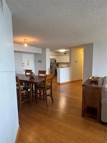 a view of a patio with a table and chairs