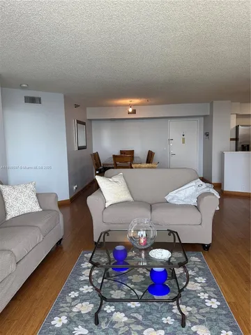 a kitchen with a sink cabinets and appliances
