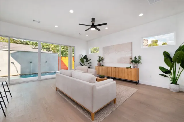 a large kitchen with kitchen island a stove a sink a center island a stove and a cabinets