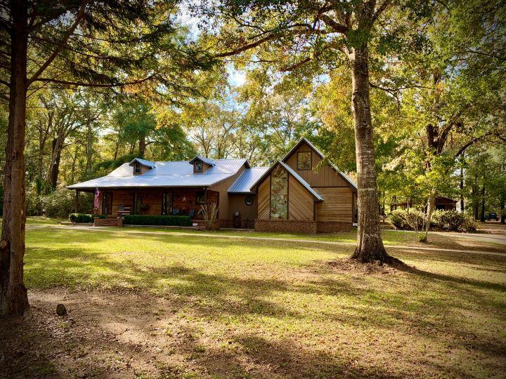 5846 Dairy Road Baker, FL 32531 - Photo 1 of 68 a small house in middle of the green field