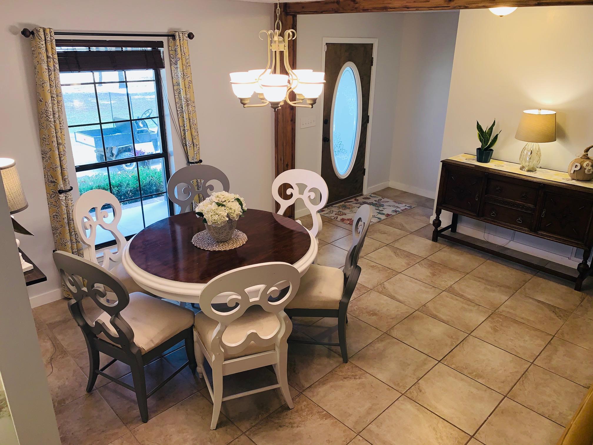5846 Dairy Road Baker, FL 32531 - Photo 11 of 68 a dining room with furniture and wooden floor